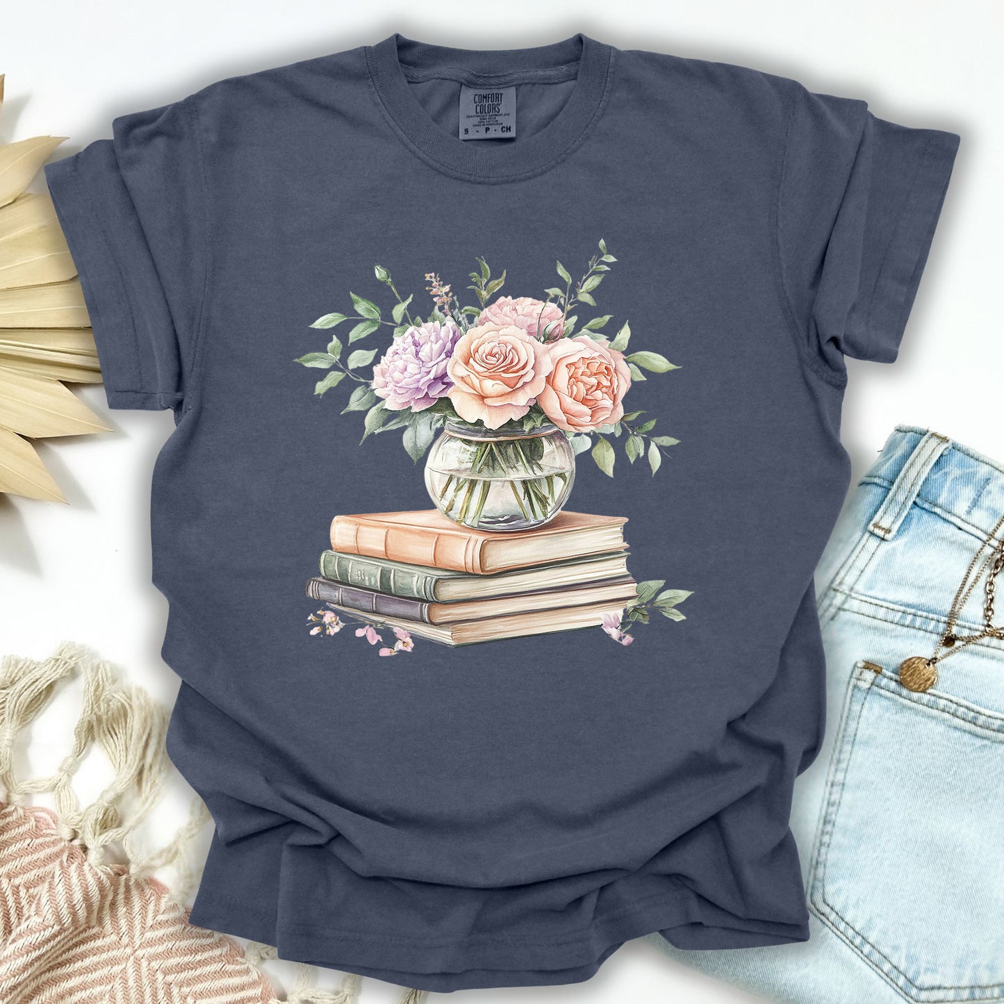 Denim S t-shirt with a watercolor bouquet of roses in a vase on vintage books.