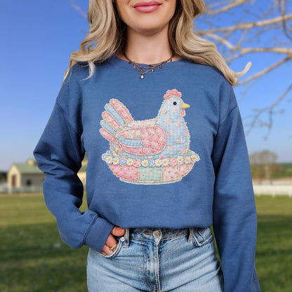 Blue unisex sweatshirt with a pastel faux patchwork hen design.
