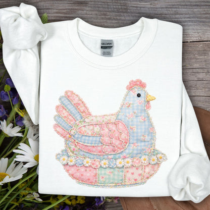 White unisex sweatshirt with a pastel faux patchwork hen design.