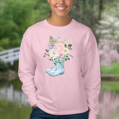 Pink long-sleeve tee with a watercolor rain boot overflowing with peonies, dahlias, roses, and a butterfly.