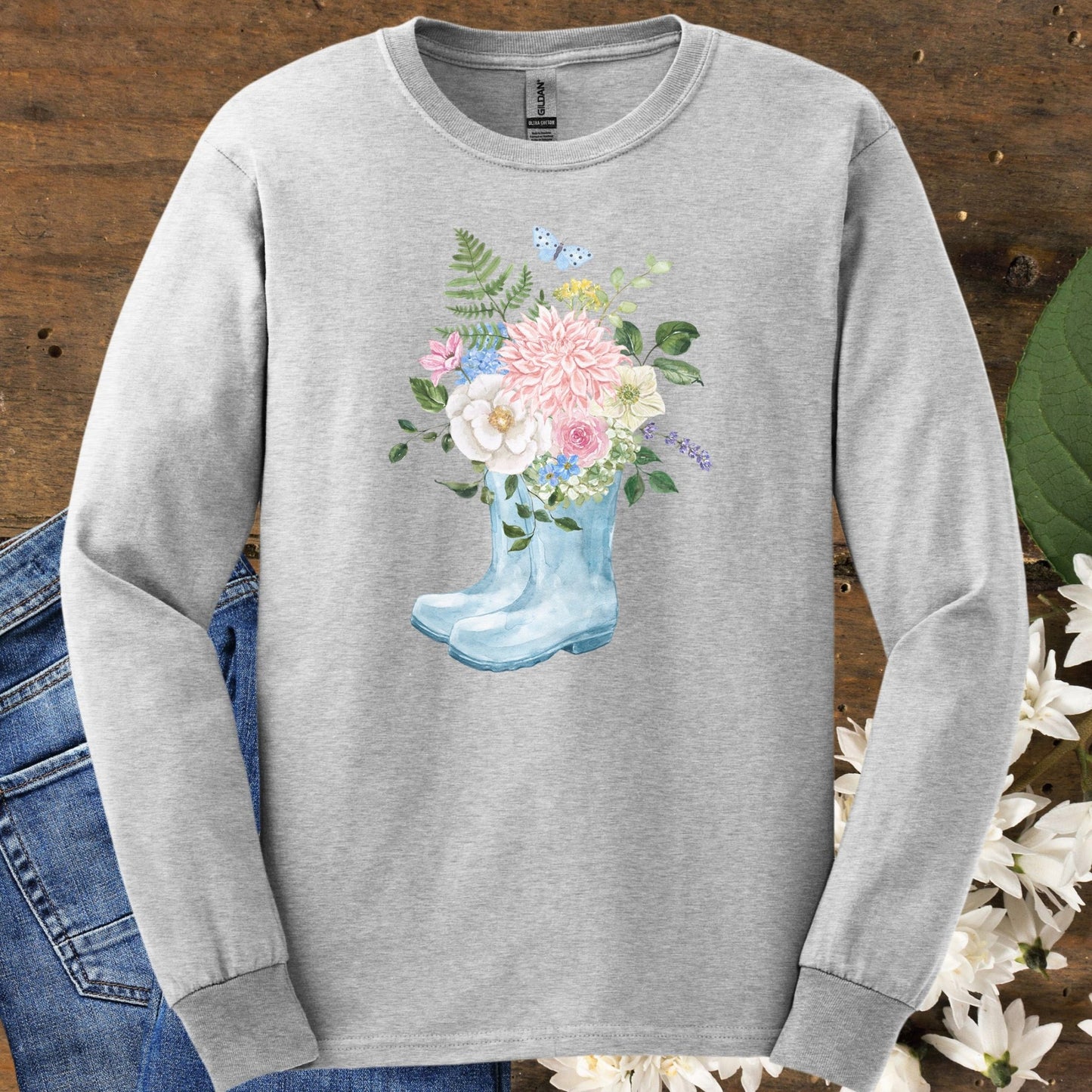 Ash long-sleeve tee with watercolor rain boot vase, peonies, dahlias, roses, hydrangeas, and a butterfly.