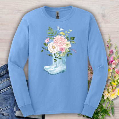 Carolina Blue long-sleeve tee with watercolor rain boots overflowing with peonies, dahlias, roses, and a butterfly.