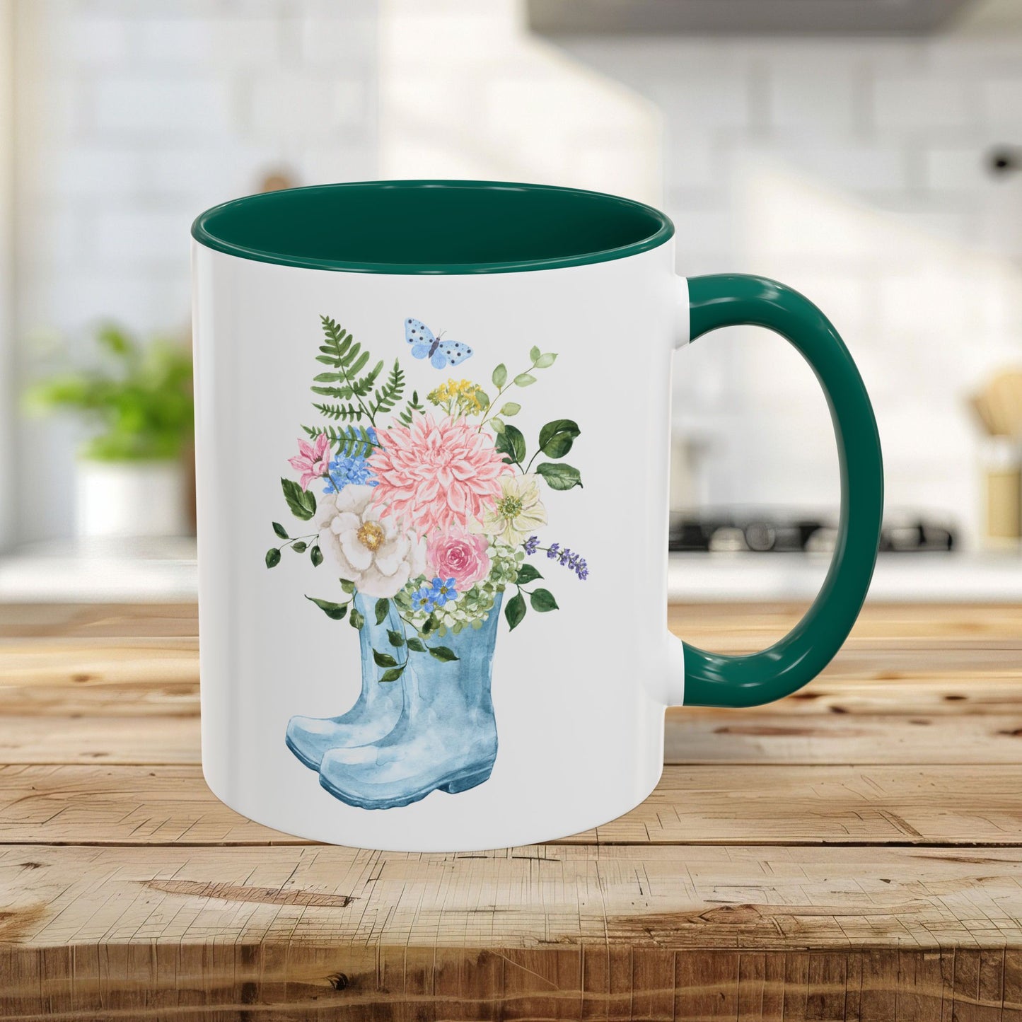 11oz glossy ceramic mug with a green handle and interior, featuring a watercolor rain boot and floral bouquet design.