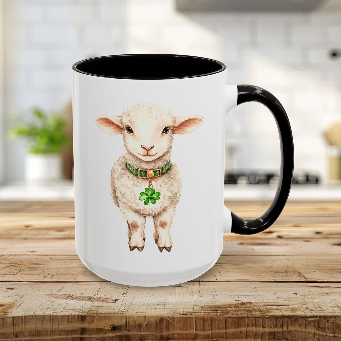 15oz white ceramic mug with black interior and handle, featuring a watercolor lamb wearing a green clover pendant.
