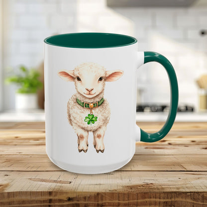 White 15oz ceramic mug with a green interior and handle, featuring a watercolor lamb wearing a clover pendant.