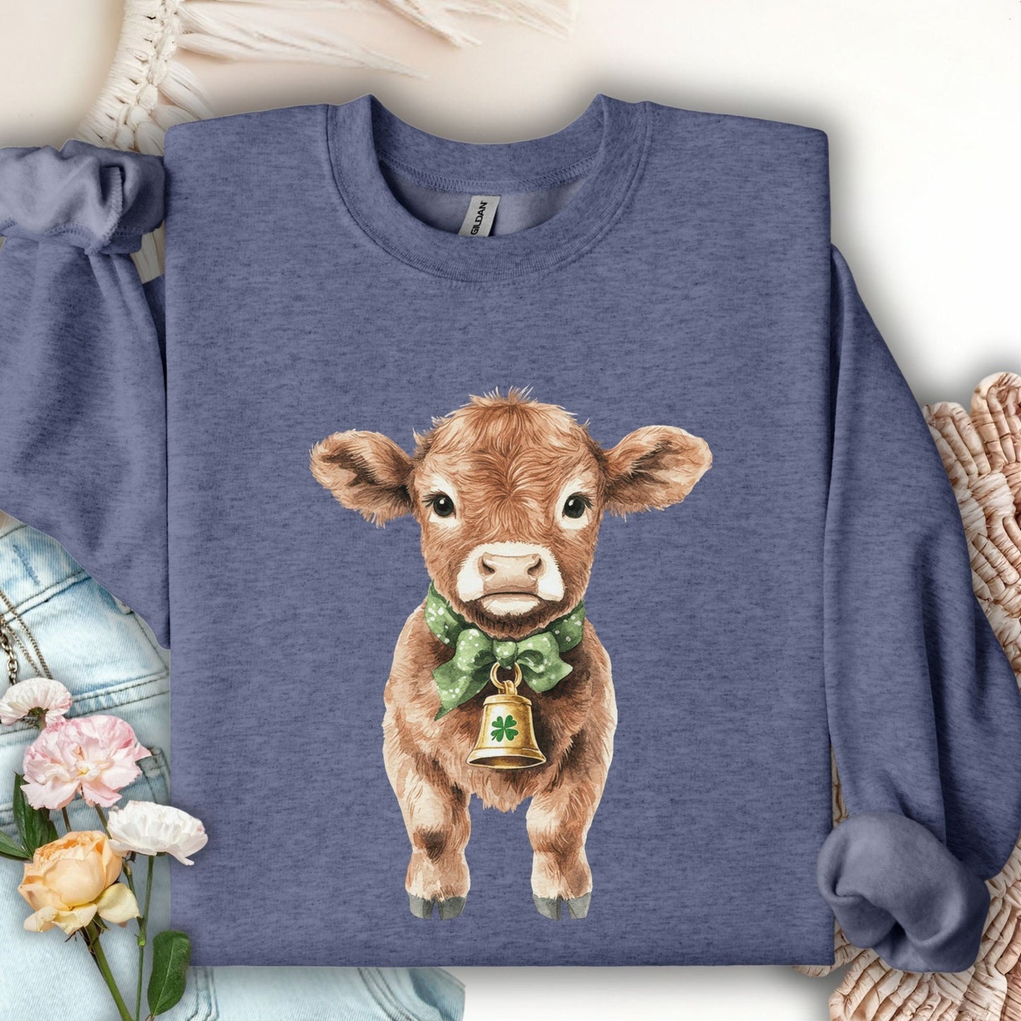 Heather Sport Dark Navy sweatshirt with a watercolor baby Highland cow, green bow, and clover bell.