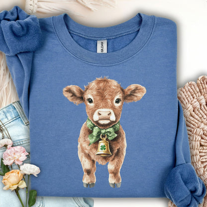 Indigo blue unisex sweatshirt with a watercolor baby Highland cow, green bow, and clover bell.
