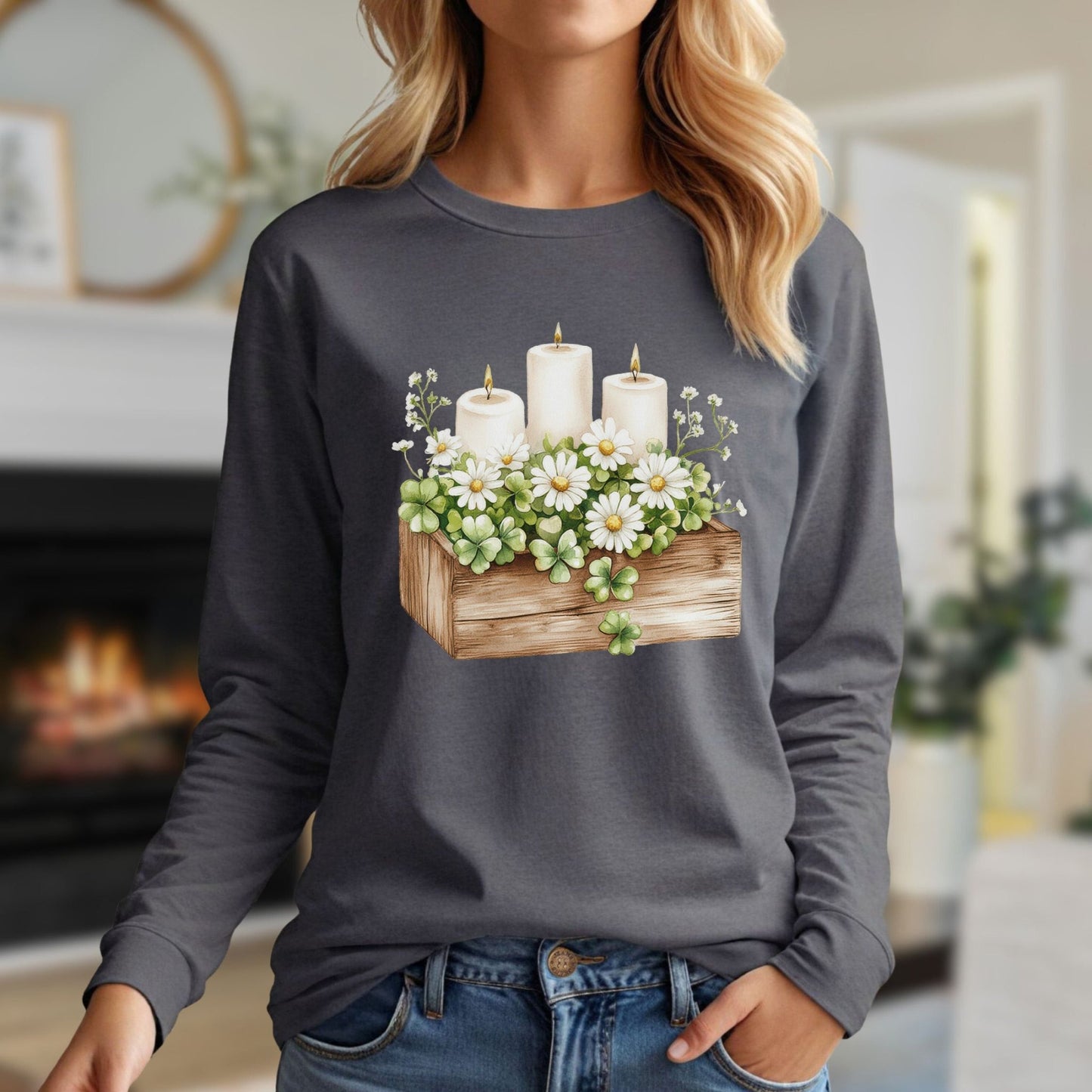 Watercolor clover planter with daisies, baby's breath, and three lit candles on a charcoal long-sleeve tee.
