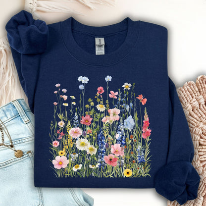 Navy Summer Meadow sweatshirt with colorful watercolor wildflowers, made from a soft cotton-blend fabric.