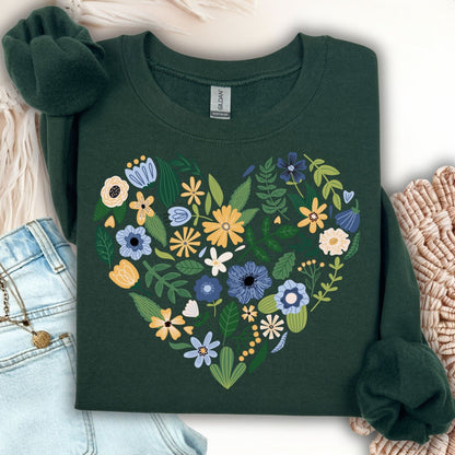 Forest green sweatshirt with a large heart made of blue, yellow, and cream floral designs.