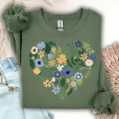 Military green sweatshirt with a heart design made of blue, yellow, and cream floral blooms.