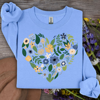 Carolina blue sweatshirt with a large heart design made of blue, yellow, and cream floral blooms.