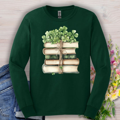 Forest Green long sleeve tee with a watercolor stack of vintage books tied with twine and clovers.