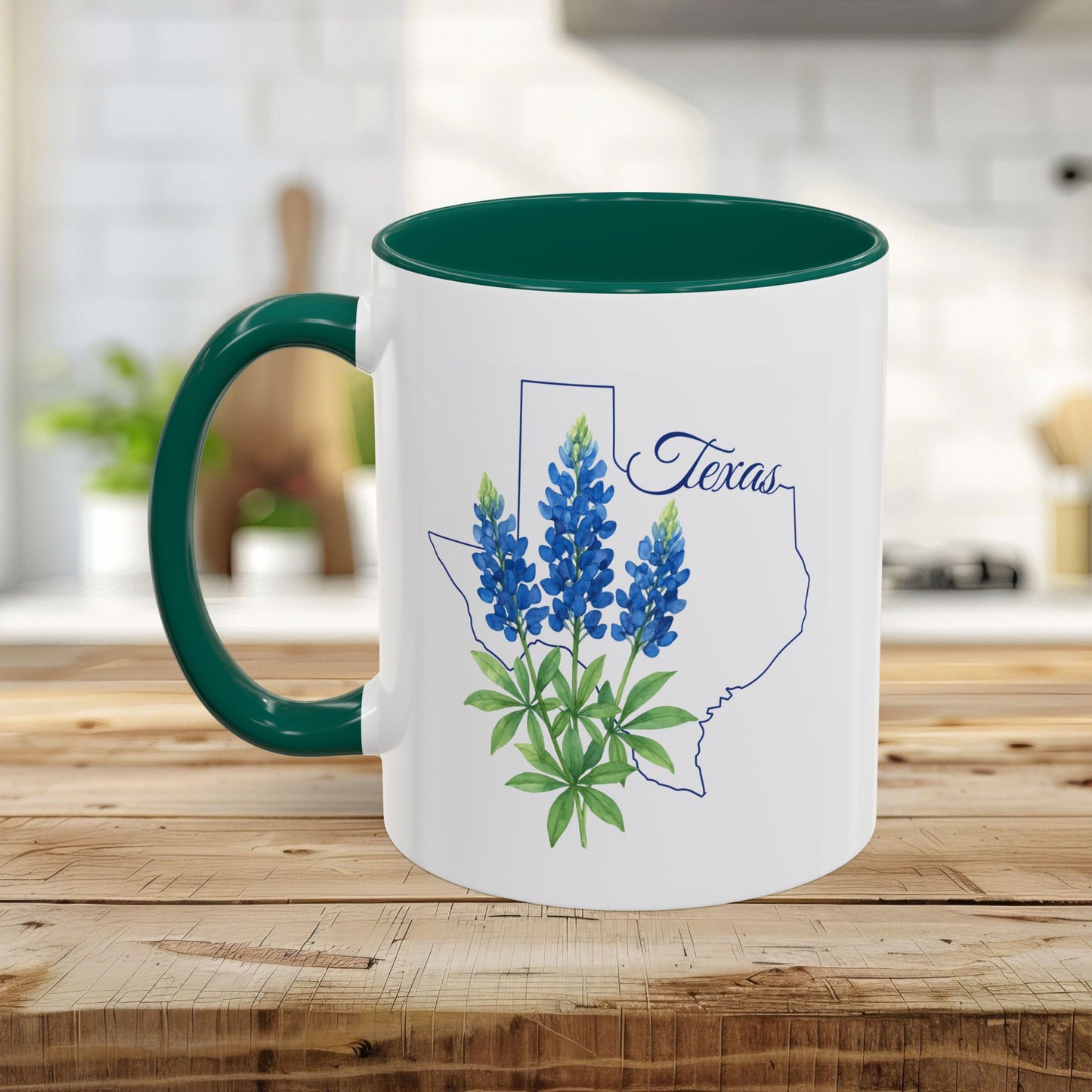 White ceramic mug with green interior and handle, featuring a bluebonnet illustration inside a Texas outline.