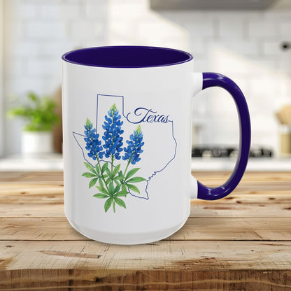 15oz white ceramic mug with bluebonnet design inside a Texas outline, purple interior and handle.
