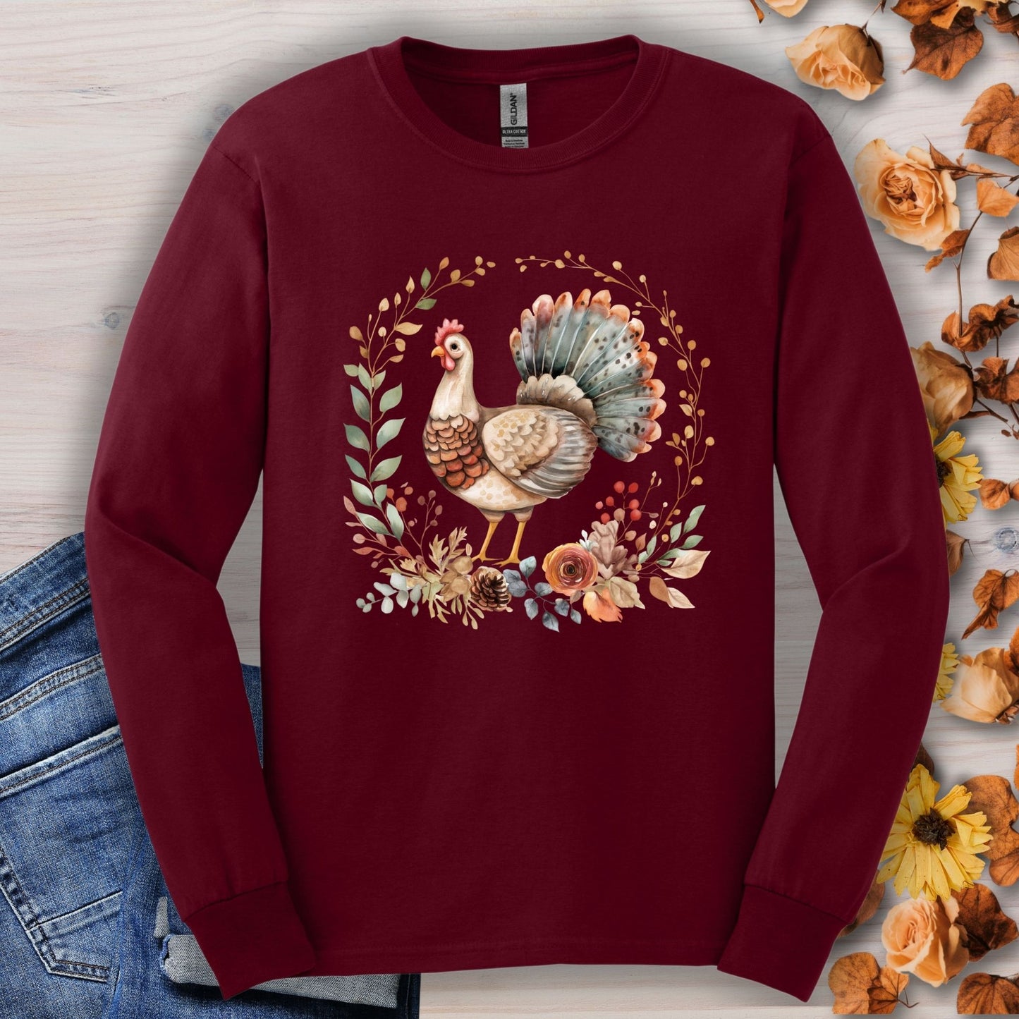 Maroon long sleeve tee with watercolor Thanksgiving turkey and autumn foliage.