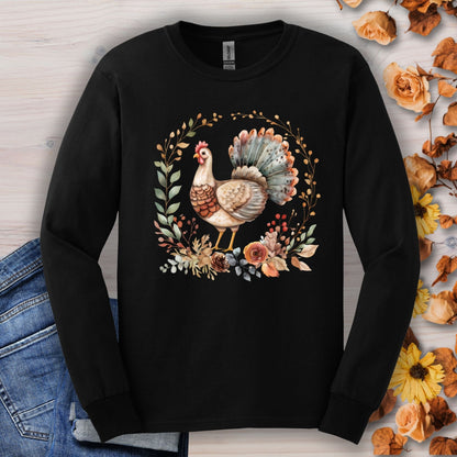 Black long sleeve tee with a watercolor Thanksgiving turkey in autumn foliage.