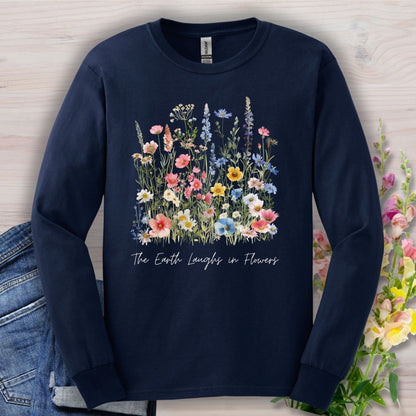 Navy long-sleeve tee with a watercolor wildflower bouquet and "The Earth Laughs in Flowers" script.