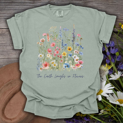 Garment-dyed Bay S cotton t-shirt with painterly wildflowers and "The Earth Laughs in Flowers" text.