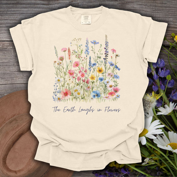 Ivory heavyweight cotton t-shirt in size S featuring a painterly wildflower print and The Earth Laughs in Flowers text.