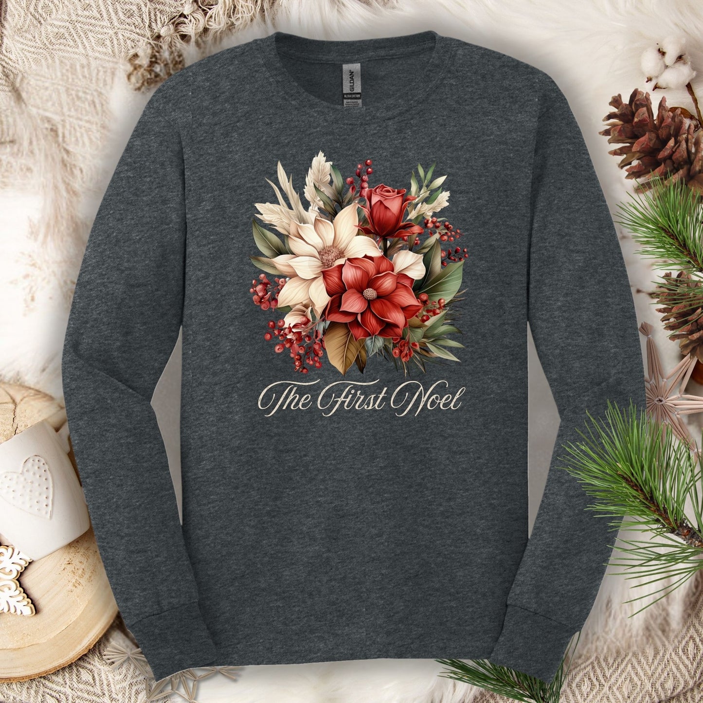 Dark Heather Gildan long sleeve tee with a watercolor Christmas bouquet and "The First Noel" text.