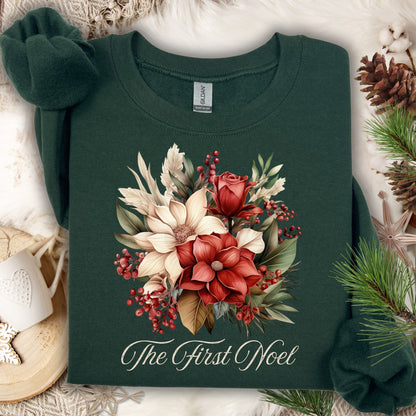 Forest Green Gildan sweatshirt with vintage poinsettia, rose, and foliage bouquet, plus "The First Noel" text.