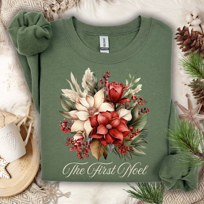 Military Green Gildan sweatshirt with vintage poinsettia, rose, and foliage bouquet, "The First Noel" text.
