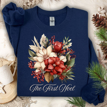Navy Gildan sweatshirt with vintage poinsettia, rose, and foliage bouquet, "The First Noel" text.