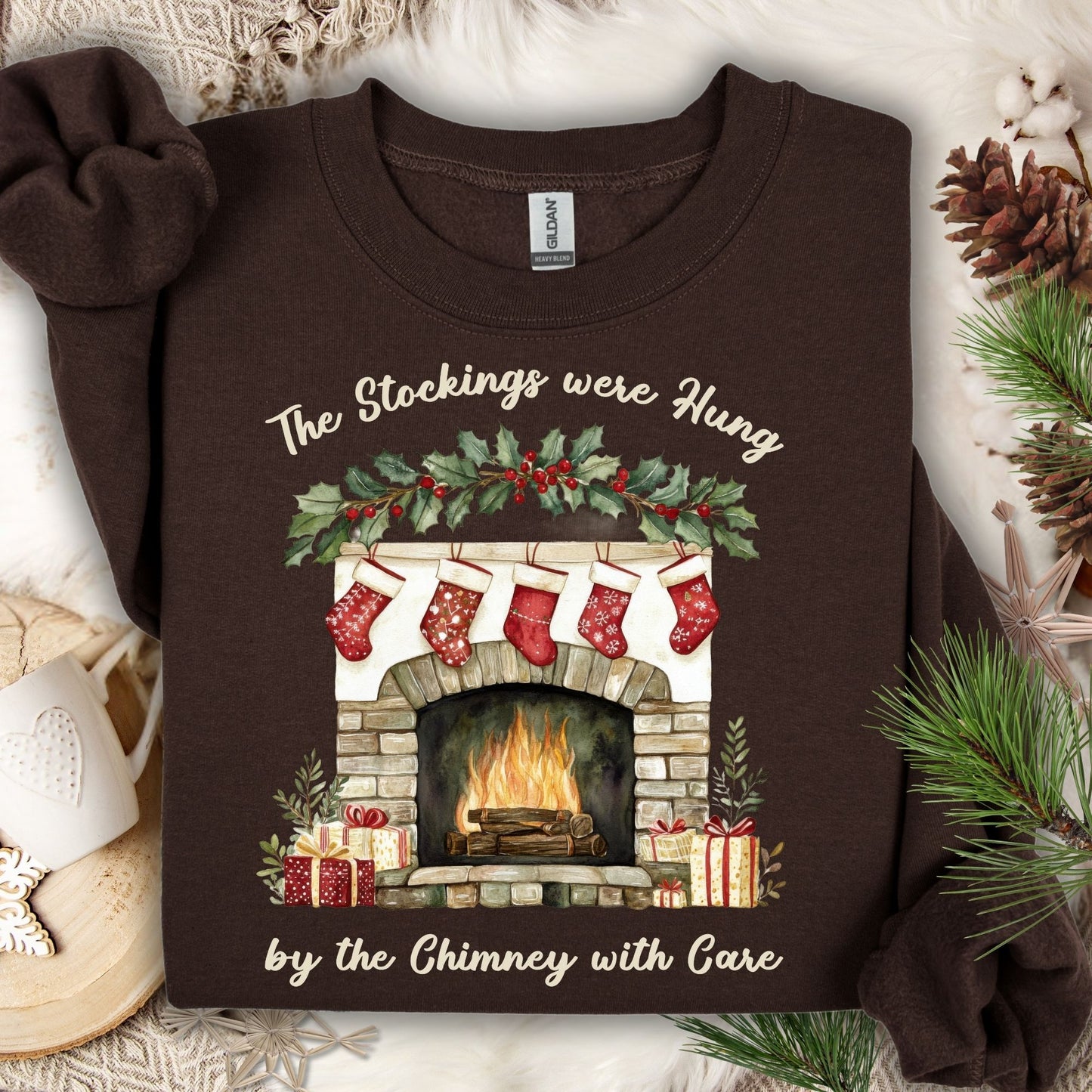 Dark Chocolate Gildan crewneck sweatshirt with "The Stockings were Hung" fireplace watercolor design.
