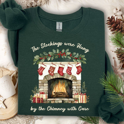 Forest Green Gildan crewneck sweatshirt with a watercolor Christmas fireplace and stockings.