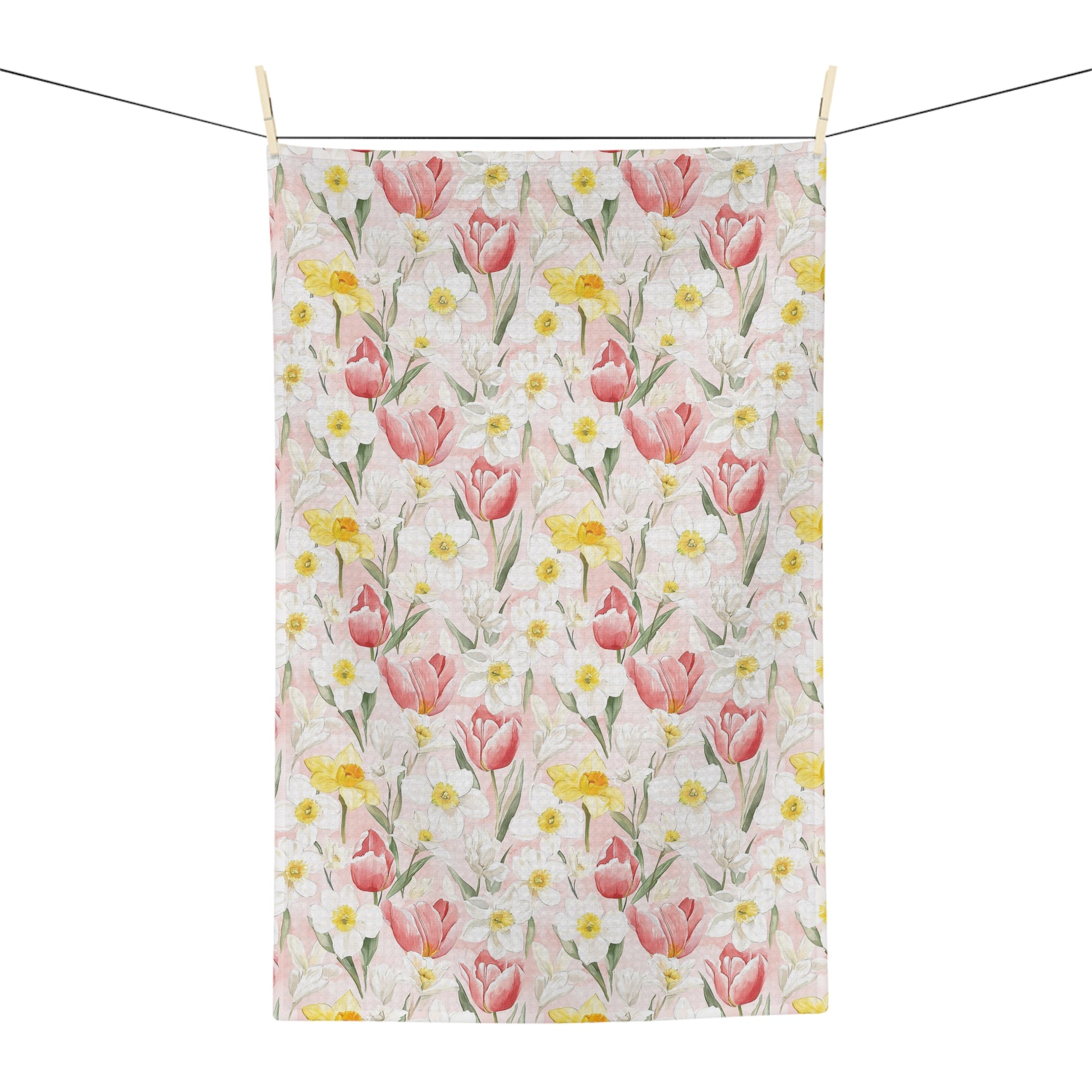 Microfiber tea towel with watercolor pink tulips, yellow daffodils, and white daisies on a light pink background.