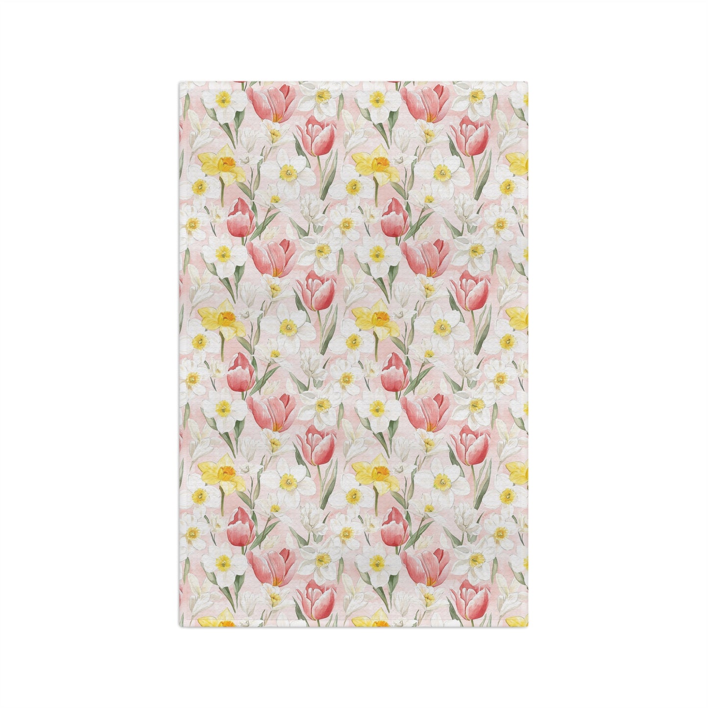 Microfiber tea towel with a watercolor pattern of pink tulips, yellow daffodils, and white daisies on a light pink background.