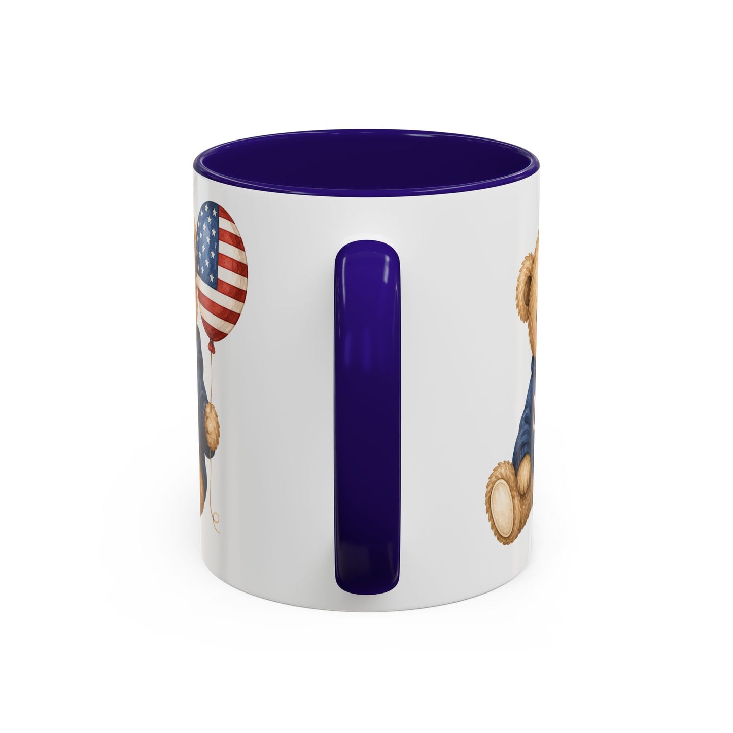 White ceramic mug with a navy handle and interior, featuring a teddy bear holding a USA flag balloon.