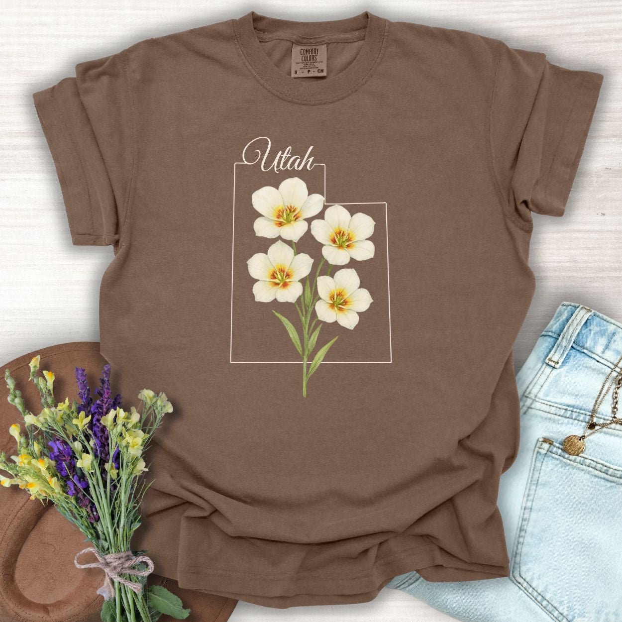 Espresso Sego Lily Utah State Flower T-shirt with watercolor design on a brown cotton tee.