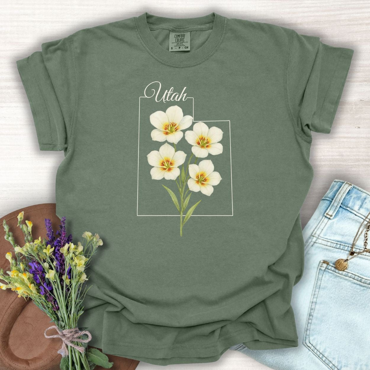 Moss green Sego Lily Utah t-shirt with watercolor flowers, made from soft, lived-in cotton.