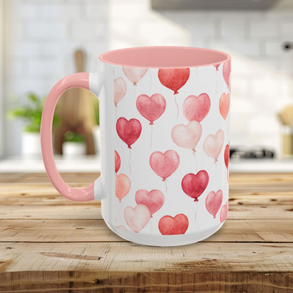 White 15 oz. ceramic mug with pink interior/handle and watercolor pink/red heart balloons.