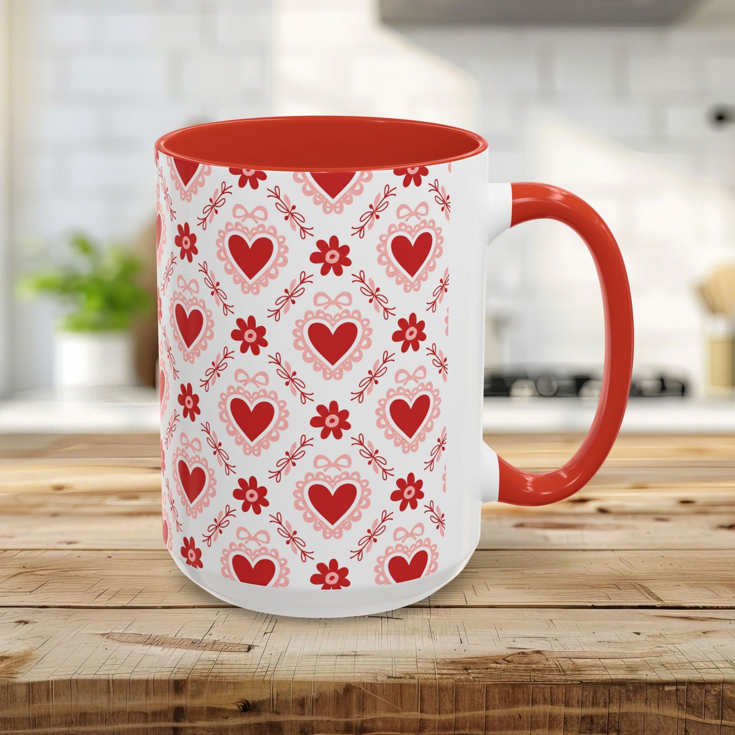 15oz ceramic mug with red interior/handle and a repeating pattern of red hearts, floral motifs, and bows.