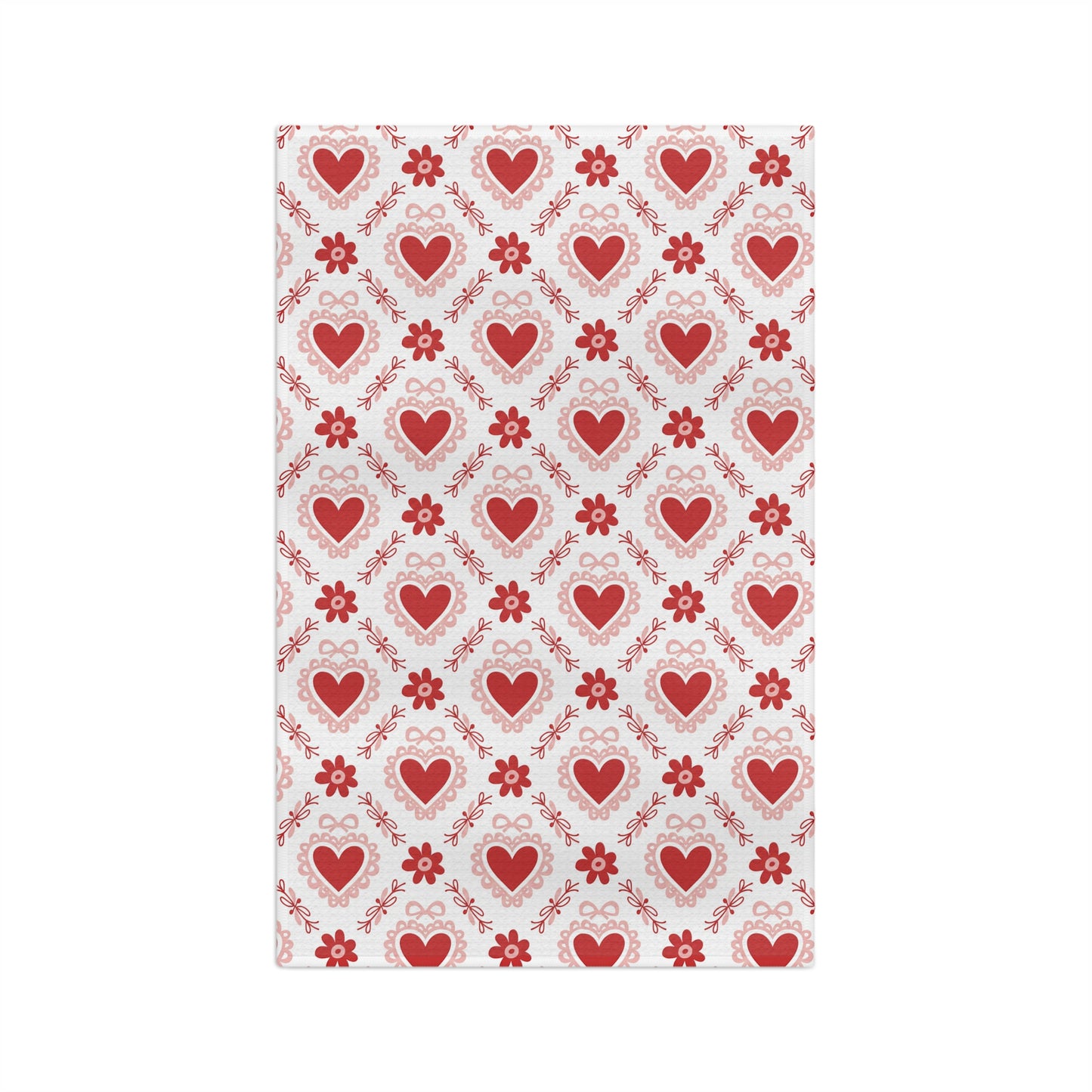 Microfiber tea towel with a repeating pattern of red hearts, pink carnations, and ribbons.