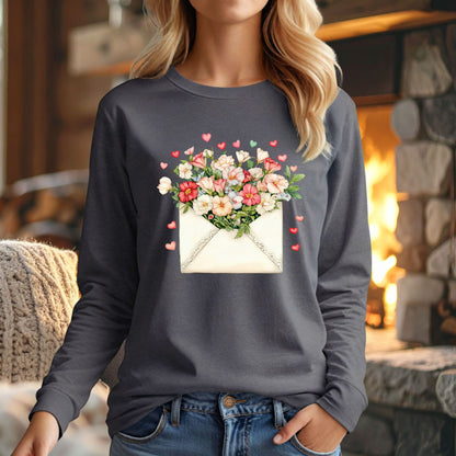 Charcoal long-sleeve tee with a vintage envelope design spilling pink and cream flowers and hearts.
