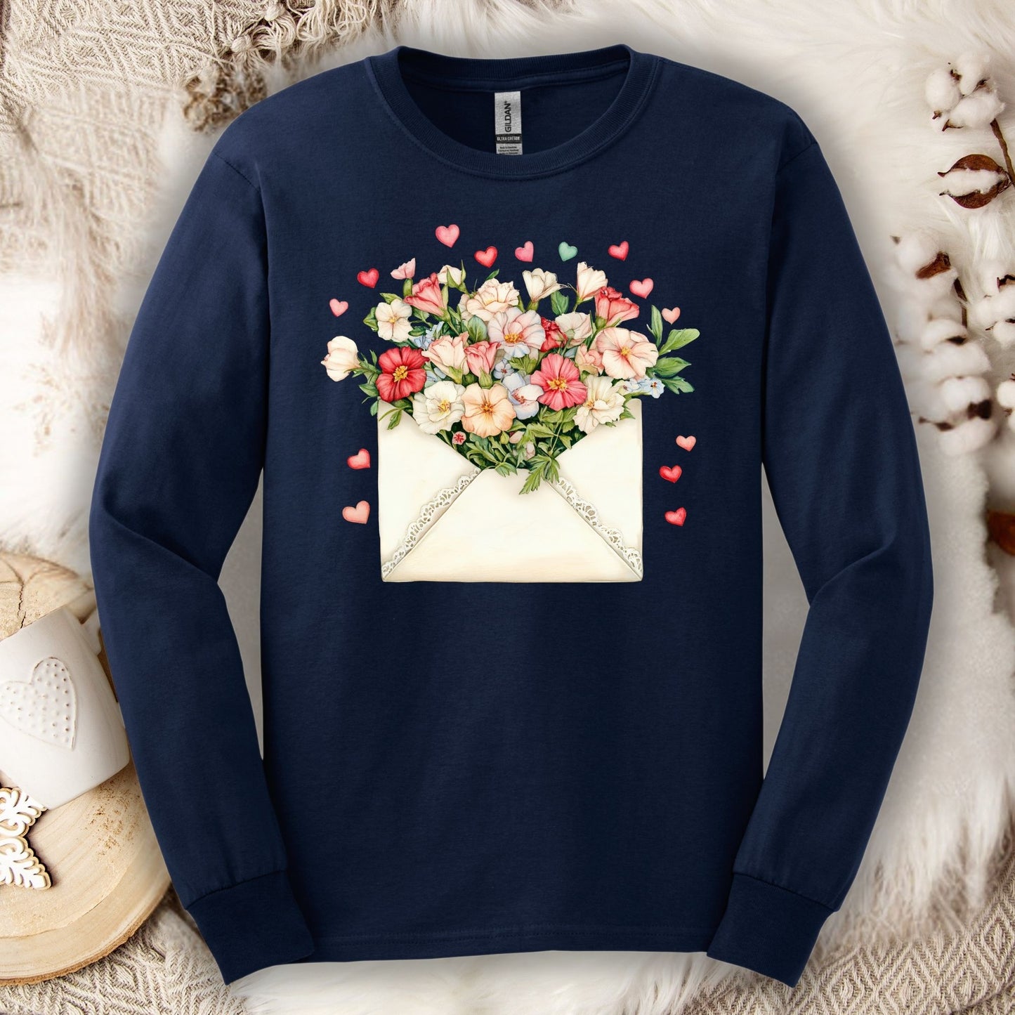 Navy long-sleeve tee with a vintage envelope spilling pink and cream flowers and hearts.
