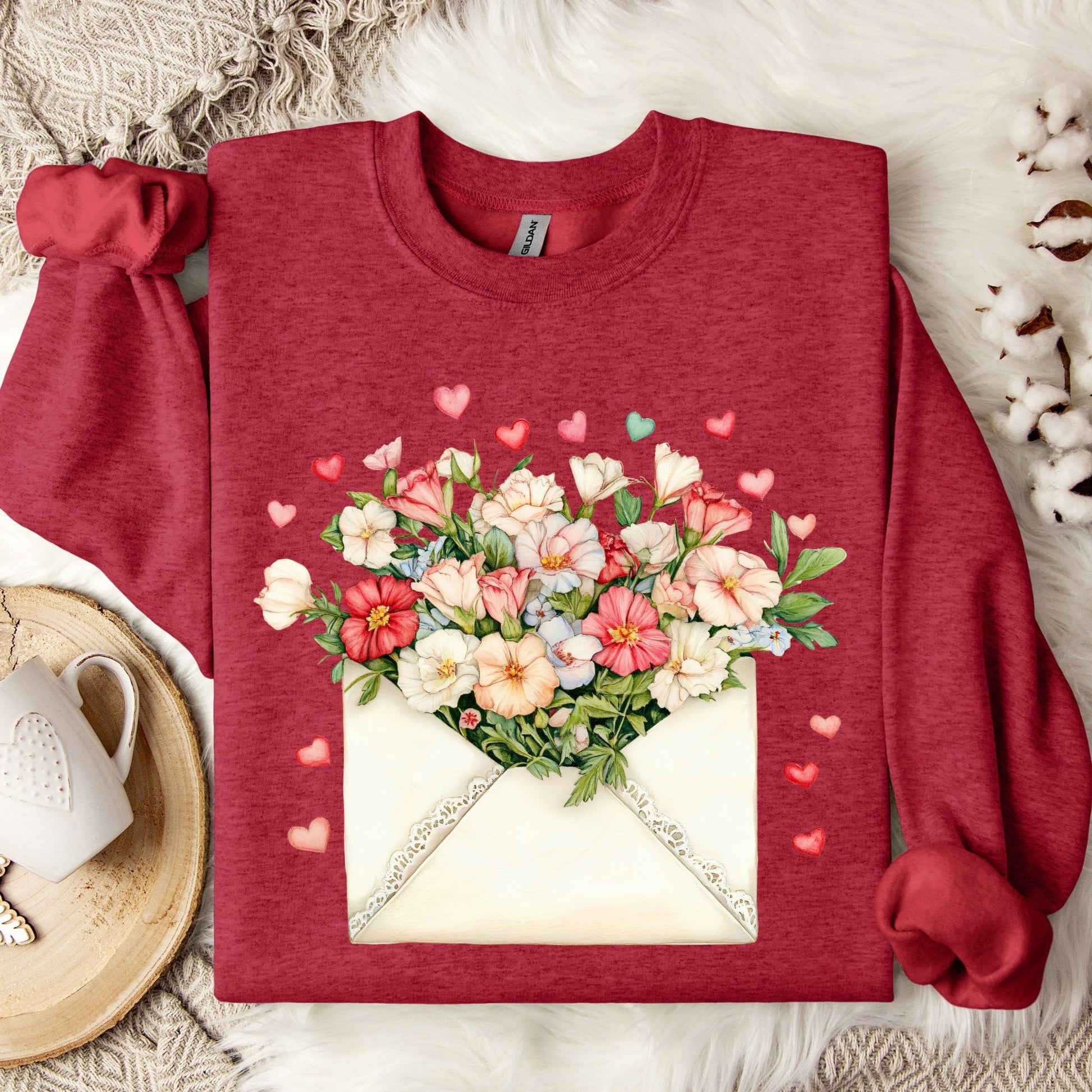 Antique Cherry Red sweatshirt with a watercolor floral love letter design and tiny hearts.