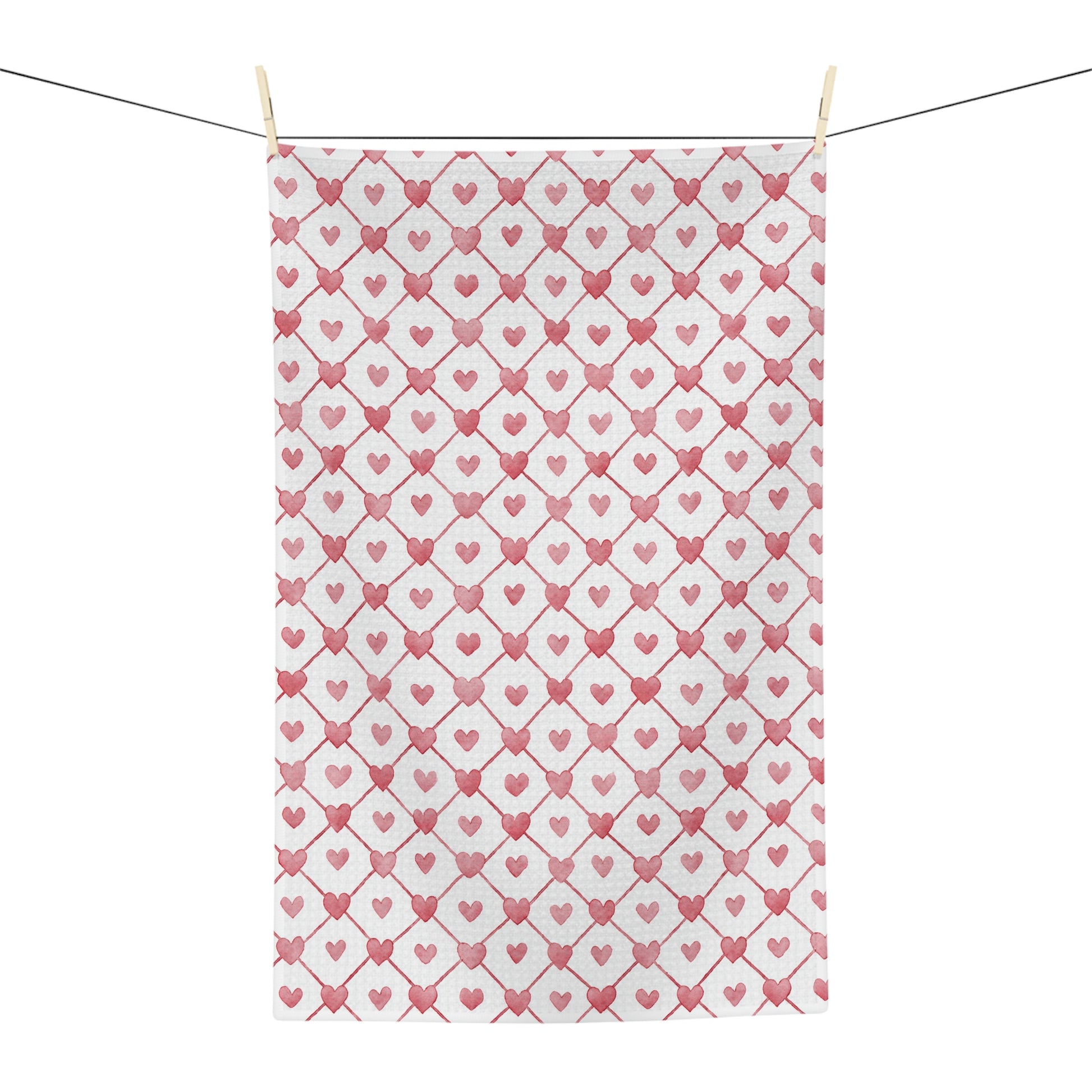Valentine's Heart Geometric Pattern Microfiber Tea Towel with red hearts on a white background, hanging on a clothesline.