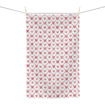 Valentine's Heart Geometric Pattern Microfiber Tea Towel with red hearts on a white background, hanging on a clothesline.
