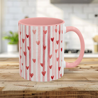 11oz glossy ceramic mug with pink interior/handle, watercolor pink stripes, and red hearts.