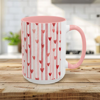 15oz ceramic mug with pink watercolor stripes, red hearts, and a pink handle and interior.