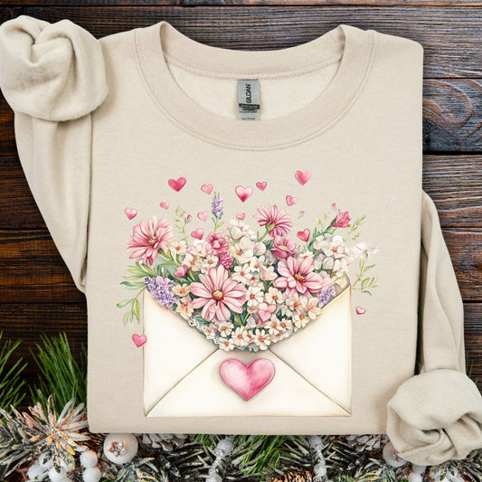 Sand S sweatshirt with vintage floral envelope design, pink flowers, and hearts.