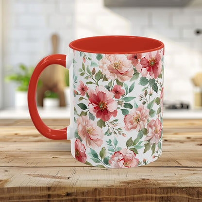 White ceramic mug with pink, white, and red watercolor peonies, red interior, and C-shaped handle.