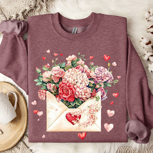 Heather Sport Dark Maroon sweatshirt with a vintage floral envelope design of red, pink, and ivory flowers and hearts.