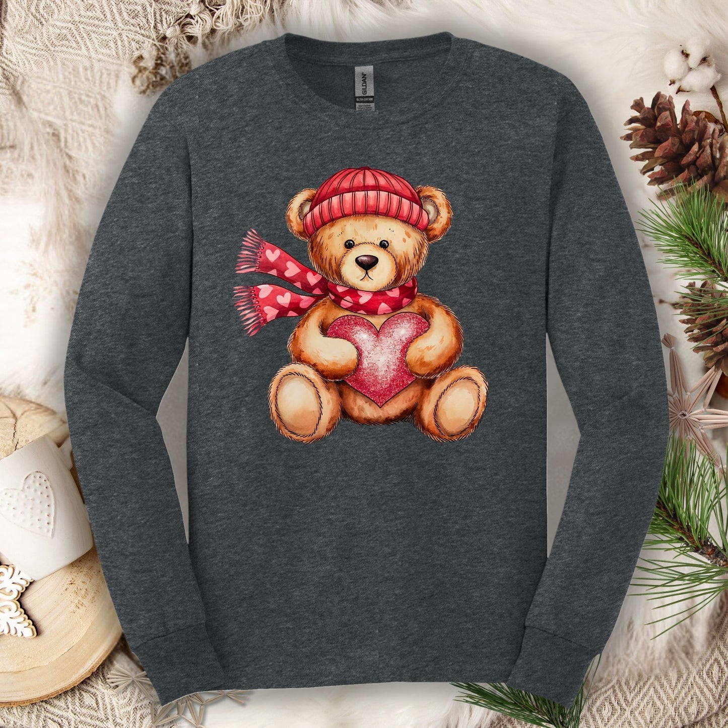 Dark Heather long sleeve tee with watercolor teddy bear holding a red heart, wearing a matching hat and scarf.