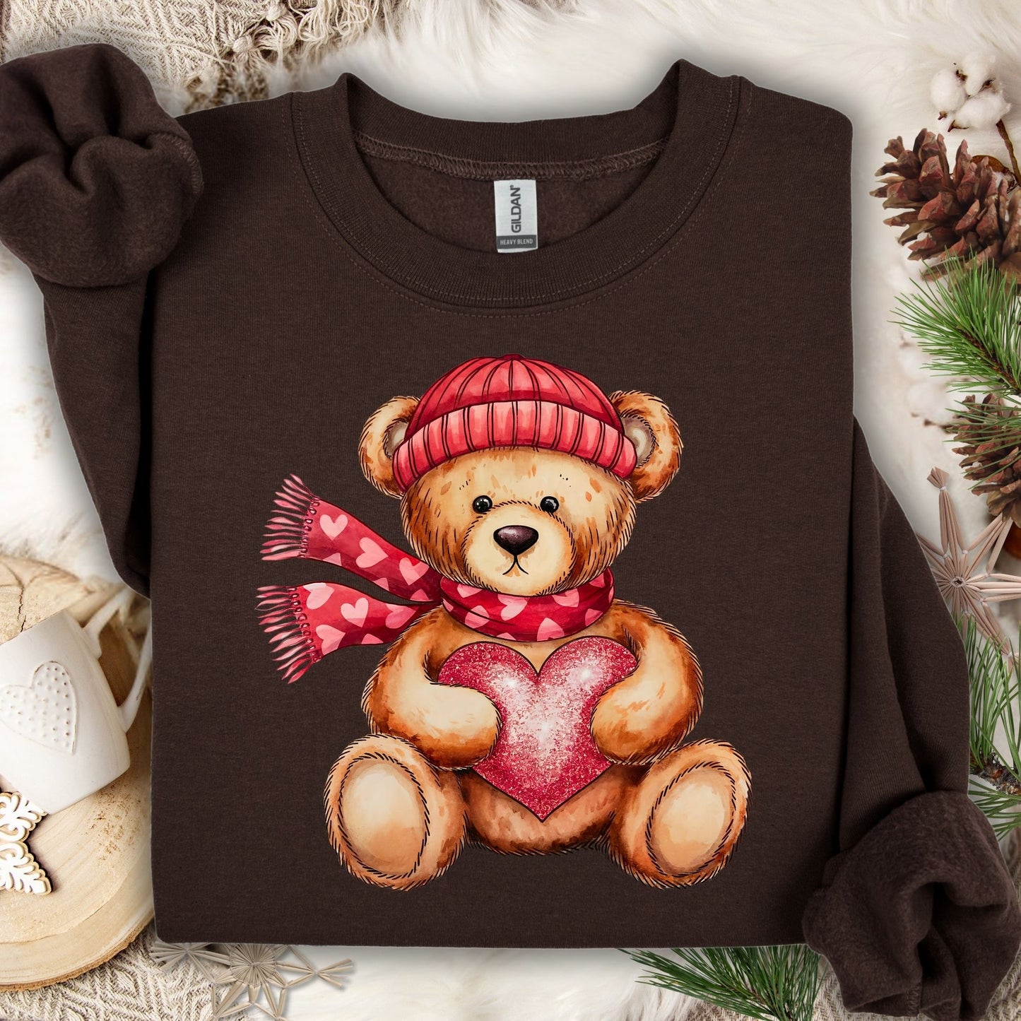 Dark Chocolate S sweatshirt with a teddy bear in a red hat and scarf holding a glittery red heart.